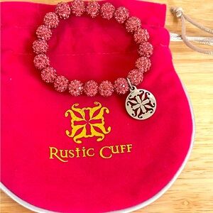 Pink rustic cuff bracelet with silver charm